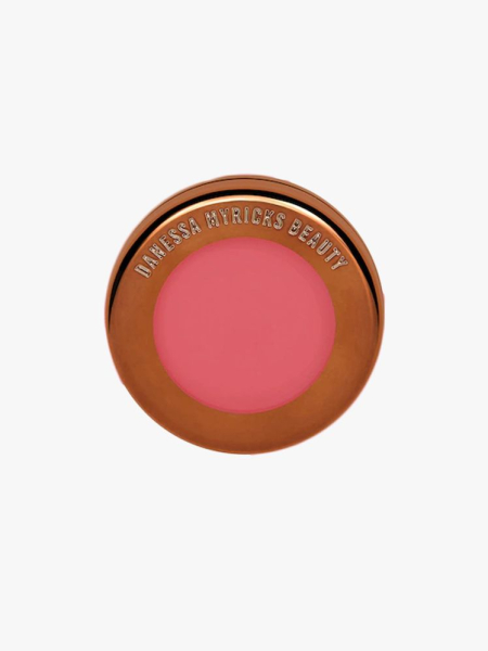 Danessa Myricks Beauty Yummy Skin Blurring Balm Powder Flushed in branded component on a light gray background
